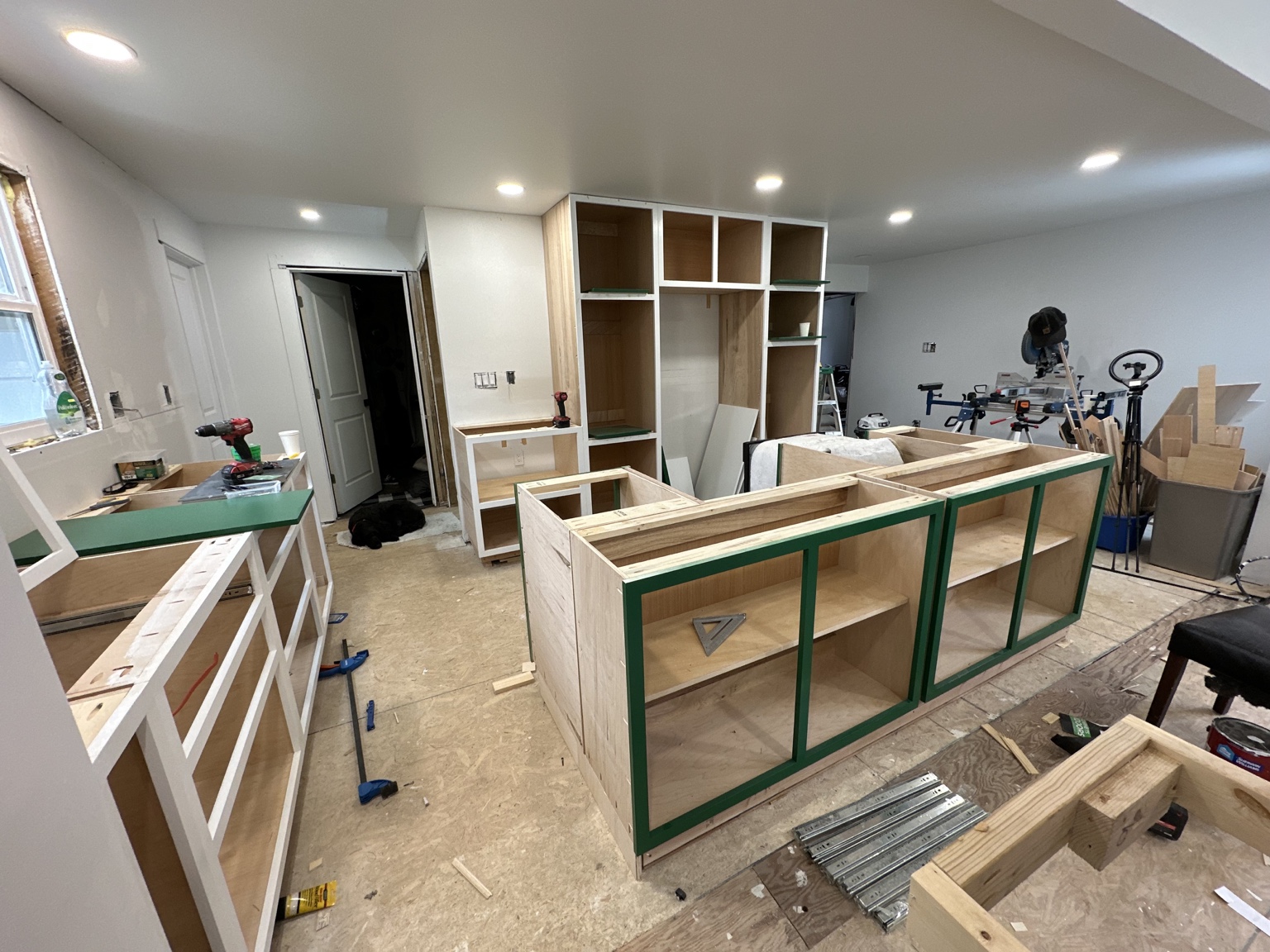 Island cabinetry and refrigerator surround